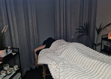 Relaxing massage table in a serene room at Bee Revived, Manchester, England, GB.