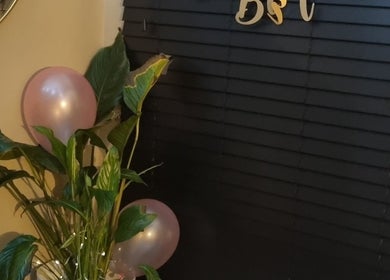 Elegant plant and pink balloon decor at Bee Revived, Manchester, England, GB.