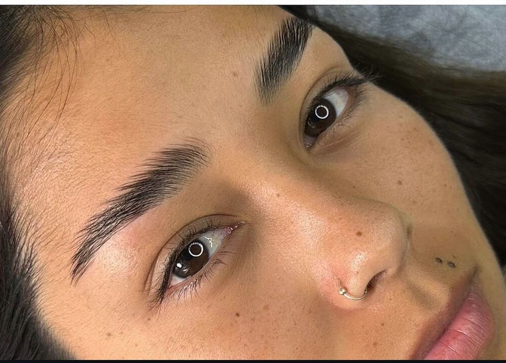 Closeup of perfectly shaped eyebrows at Lashes by Katie and Skincare, Bethesda, Maryland, US.