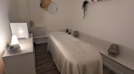 Relaxing spa room at Orchid Therapies, Leven, Scotland, GB, featuring a massage table with ambient lighting.