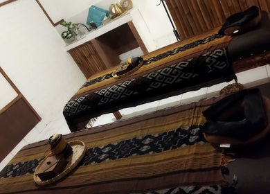 Two massage tables at Gili Mo Beauty Spa & Hair Salon, Nusa Tenggara Barat, ID, exuding tranquility.