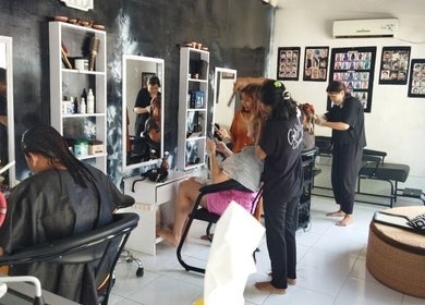 Stylists at work in Gili Mo Beauty Spa & Hair Salon, Nusa Tenggara Barat, ID, creating chic hairstyles.