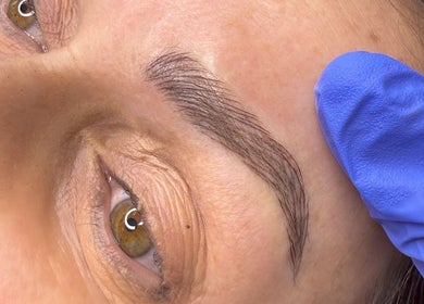 Close-up of expertly shaped eyebrow at By Megan Robinson, Plymouth, England, GB, showcasing precise beauty techniques.
