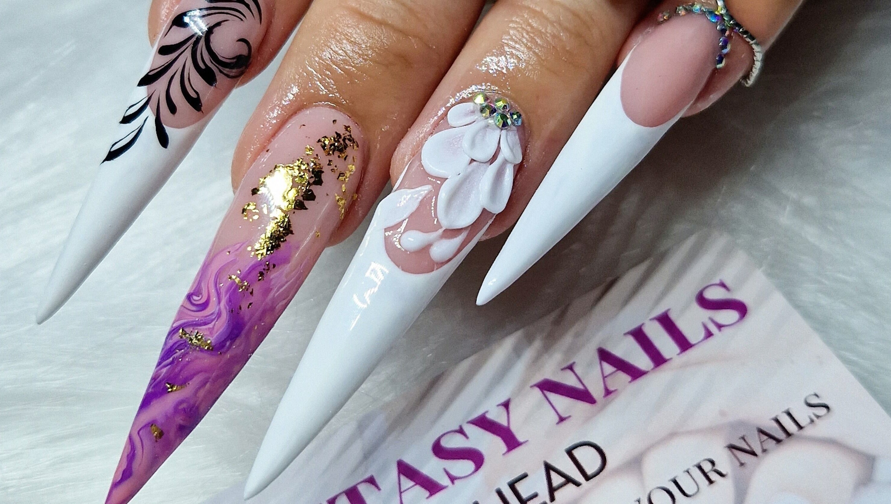 Exquisite nail art with intricate designs at Fantasy Nails, Holyhead, Cymru, GB.