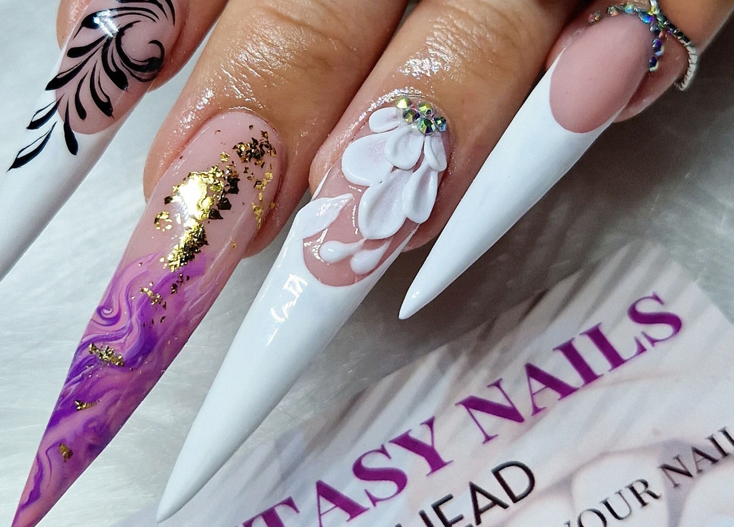 Exquisite nail art with intricate designs at Fantasy Nails, Holyhead, Cymru, GB.