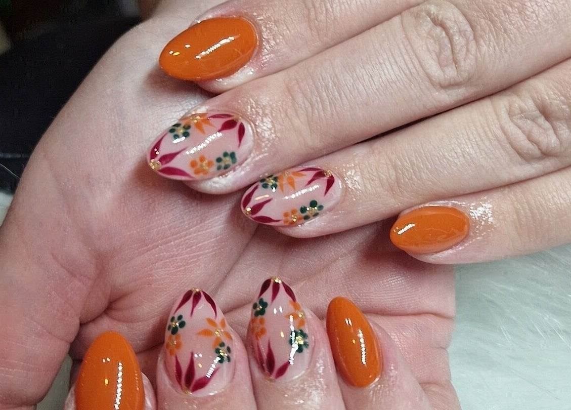 Floral nail art at Fantasy Nails, Holyhead, Cymru, GB showcasing vibrant designs.