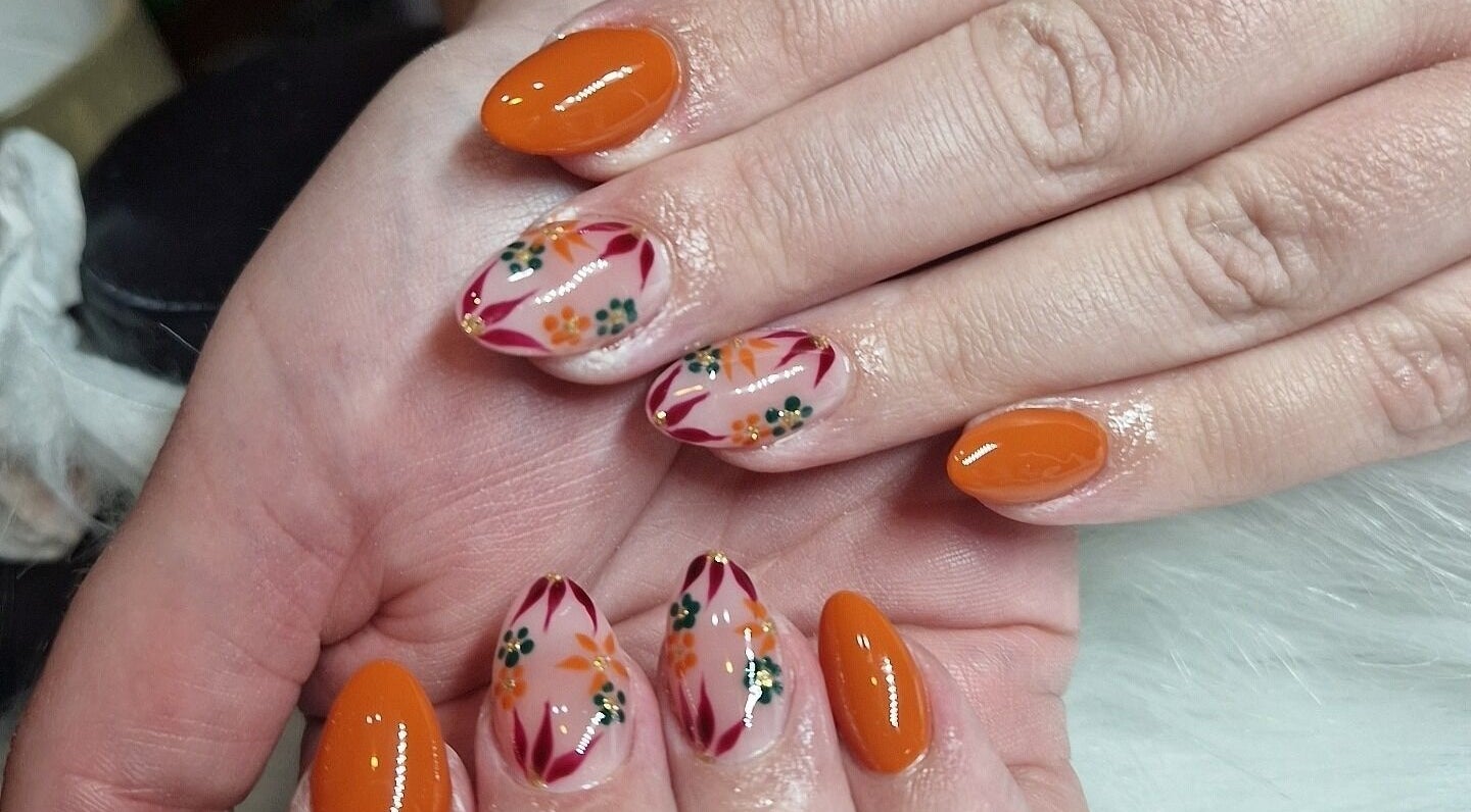 Floral nail art at Fantasy Nails, Holyhead, Cymru, GB showcasing vibrant designs.