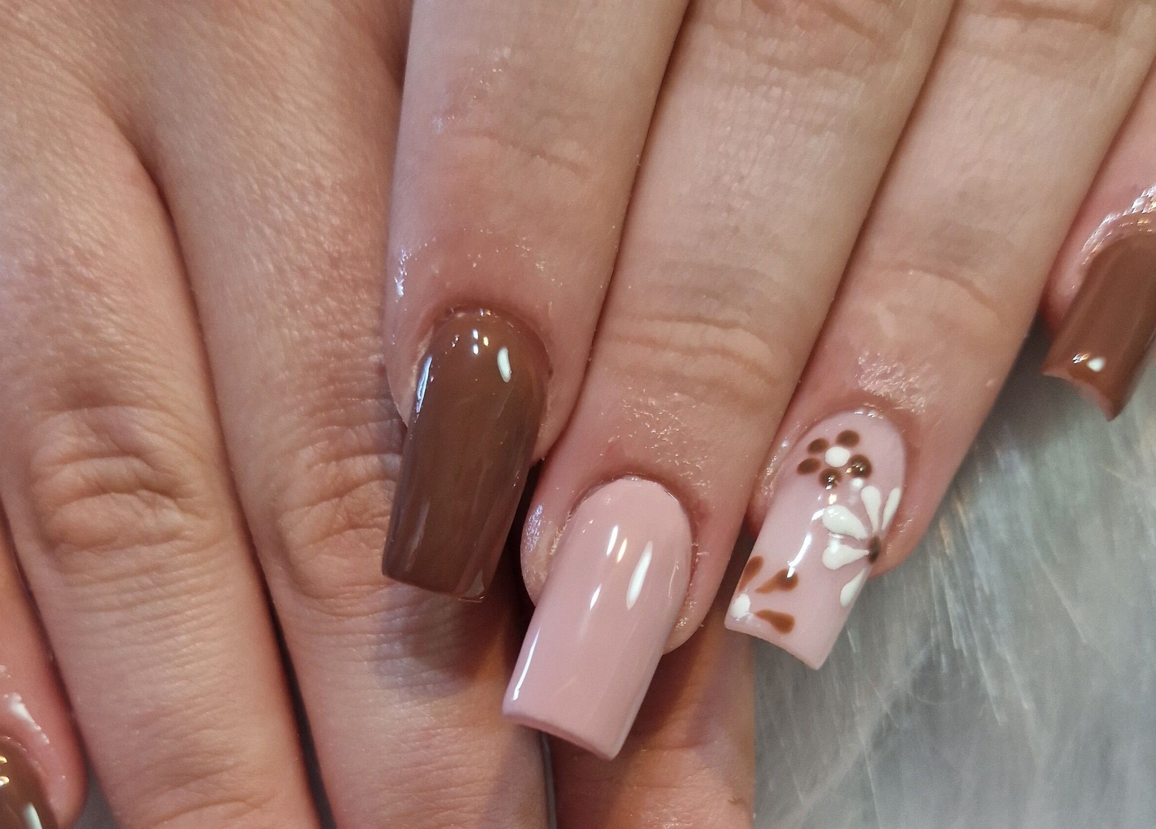 Elegant brown and pink floral nail art at Fantasy Nails, Holyhead, Cymru, GB.