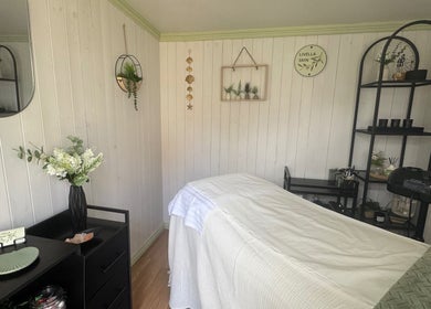 Relaxing interior of Livella Skin spa room in Chester, England, GB with massage bed and calming decor.
