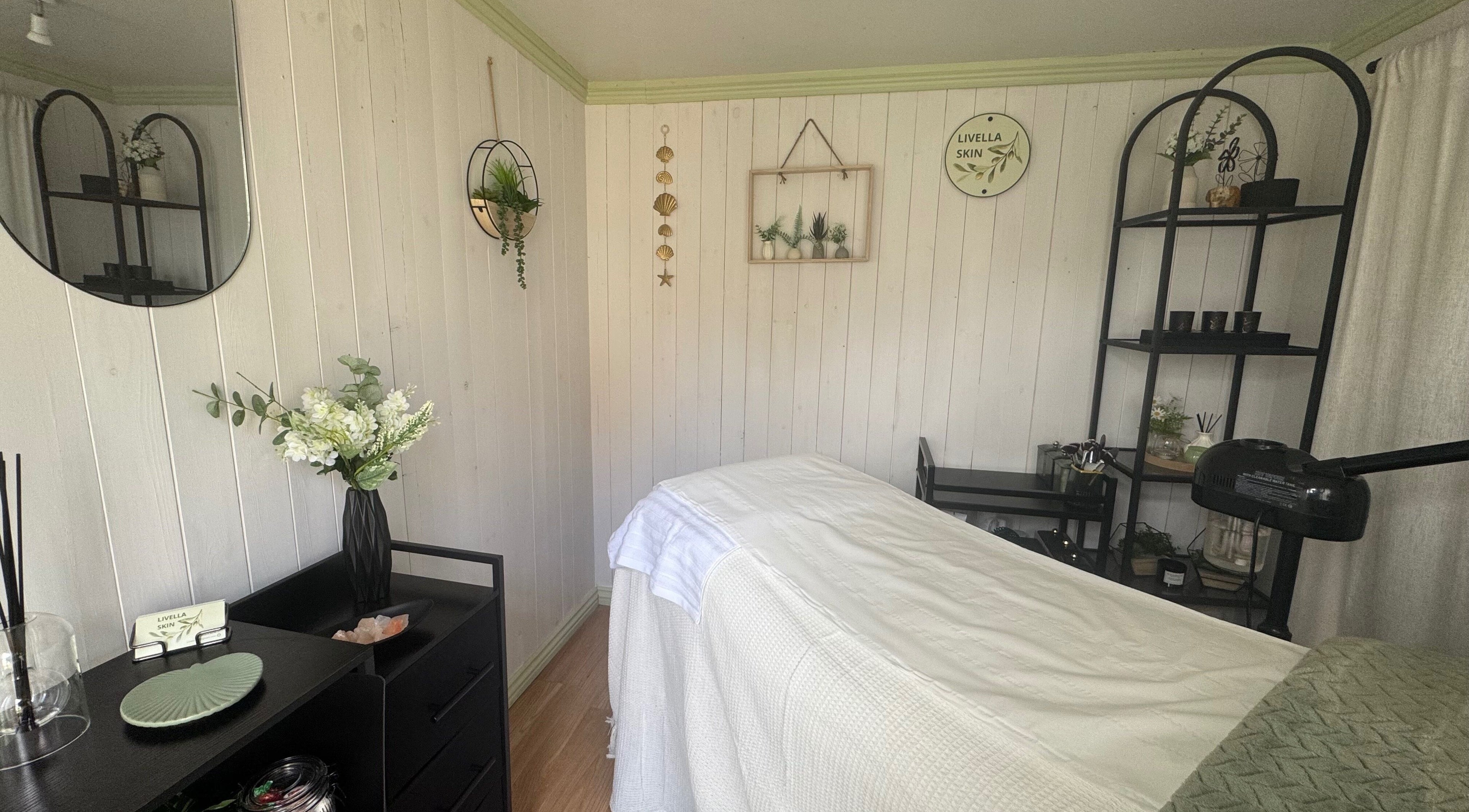 Relaxing interior of Livella Skin spa room in Chester, England, GB with massage bed and calming decor.