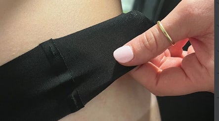 Close-up of seamless black fabric treatment at Aesthete, Hyrum, Utah, US showcasing beauty service.