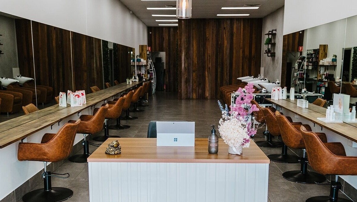 Elegant interior of Soho Hair Salon in Narellan, New South Wales, AU featuring stylish chairs and decor.