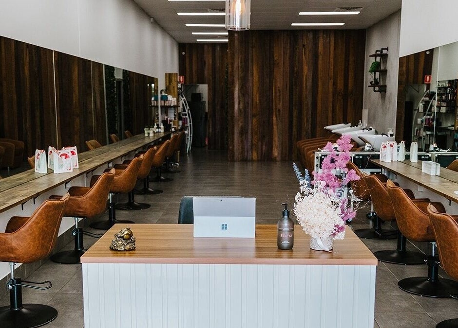 Elegant interior of Soho Hair Salon in Narellan, New South Wales, AU featuring stylish chairs and decor.