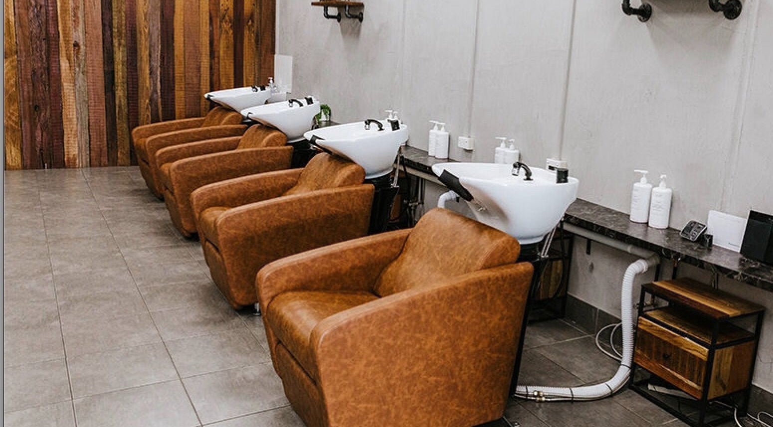 Luxurious hair wash stations at Soho Hair Salon in Narellan, New South Wales, AU offer comfort and style.