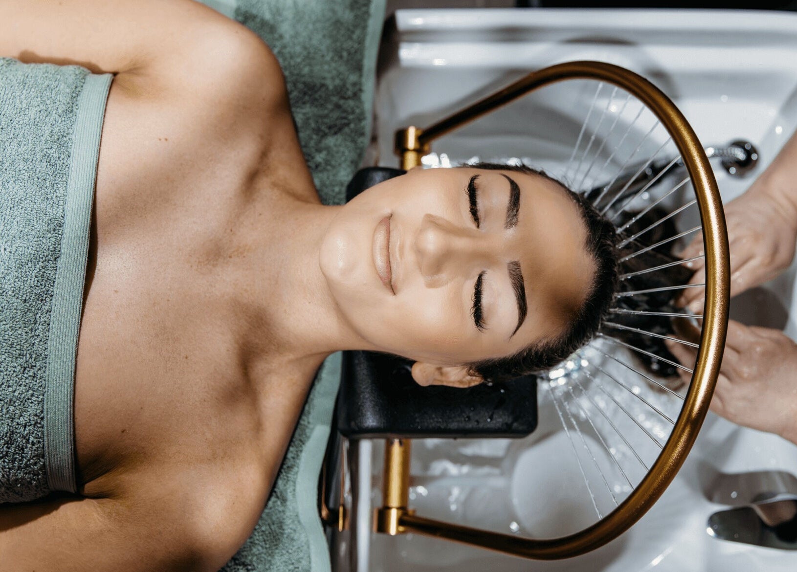 Client enjoying a relaxing hair wash at Soho Hair Salon, Narellan, New South Wales, AU.