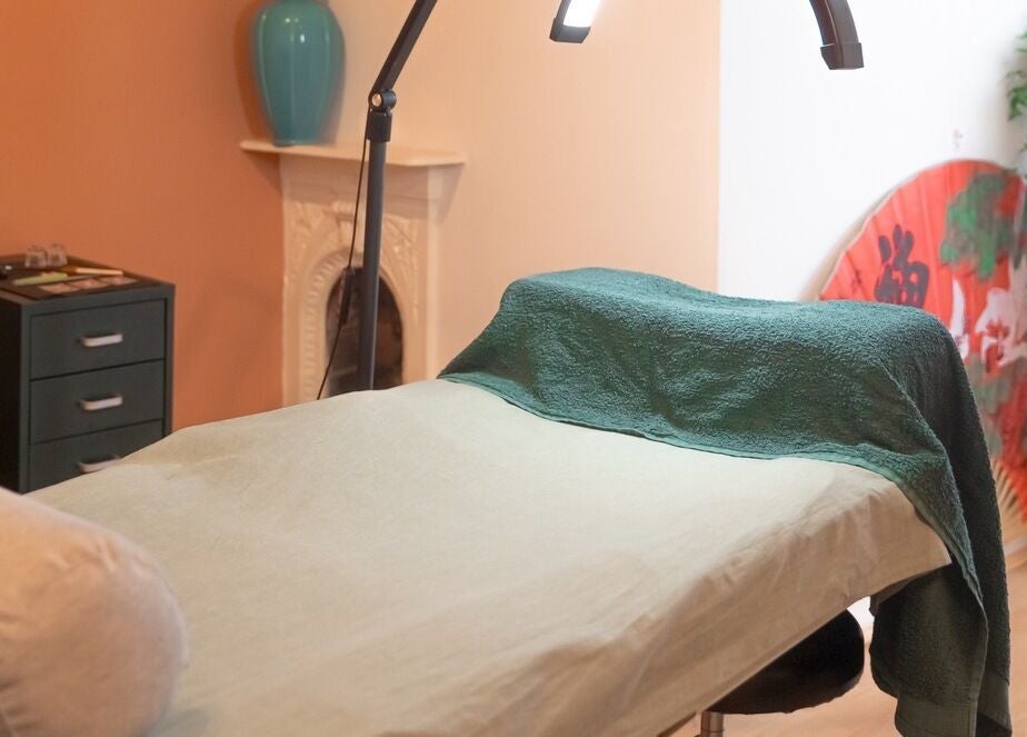 Relaxing treatment room at Kanti Studio, Colwick, England, GB, featuring a massage table and calming decor.