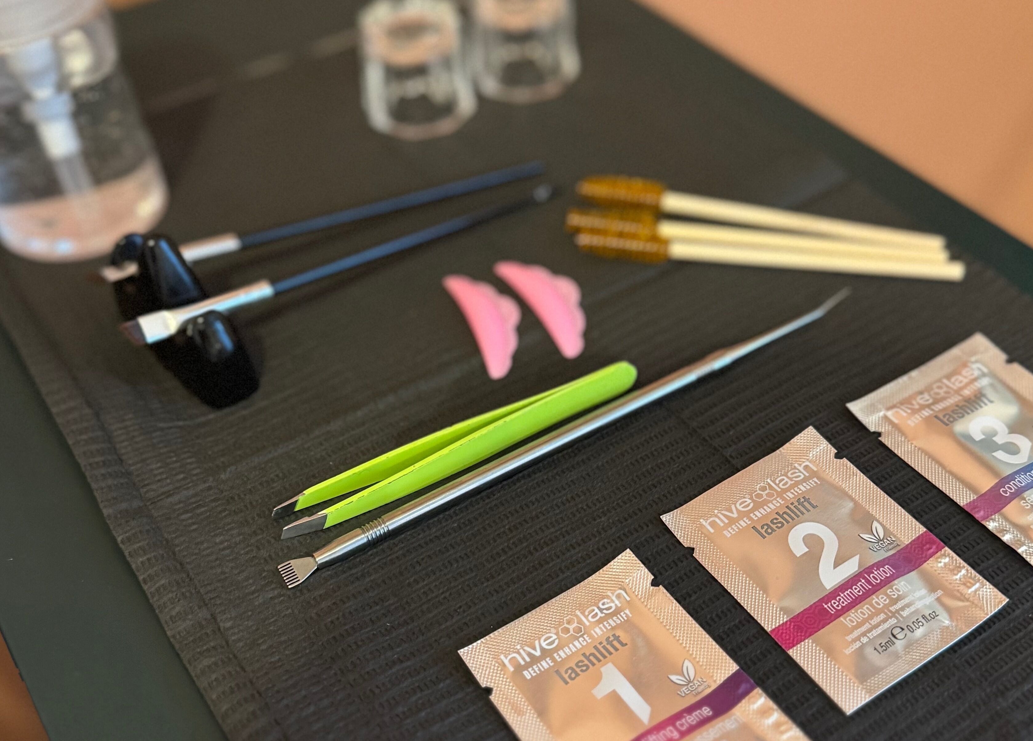 Lash lift tools and products at Kanti Studio, Colwick, England, GB on a black mat for beauty treatments.