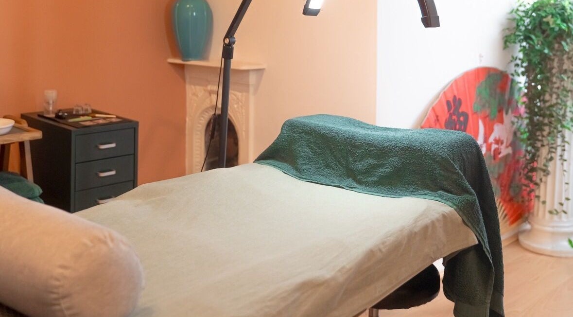 Cozy treatment room at Kanti Studio in Colwick, England. Features massage table and calming decor.