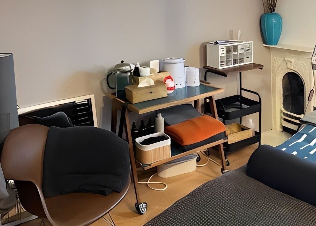 Kanti Studio therapy room in Colwick, England, GB with a cozy massage setup and calming décor.