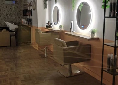 Chic, modern interior of Preston & Co Hairdressing in Clayton-le-woods, England, GB with stylish salon chairs.