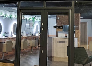 Front view of Preston & Co Hairdressing salon in Clayton-le-woods, England, showcasing chic interiors.