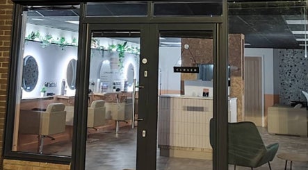 Front view of Preston & Co Hairdressing salon in Clayton-le-woods, England, showcasing chic interiors.