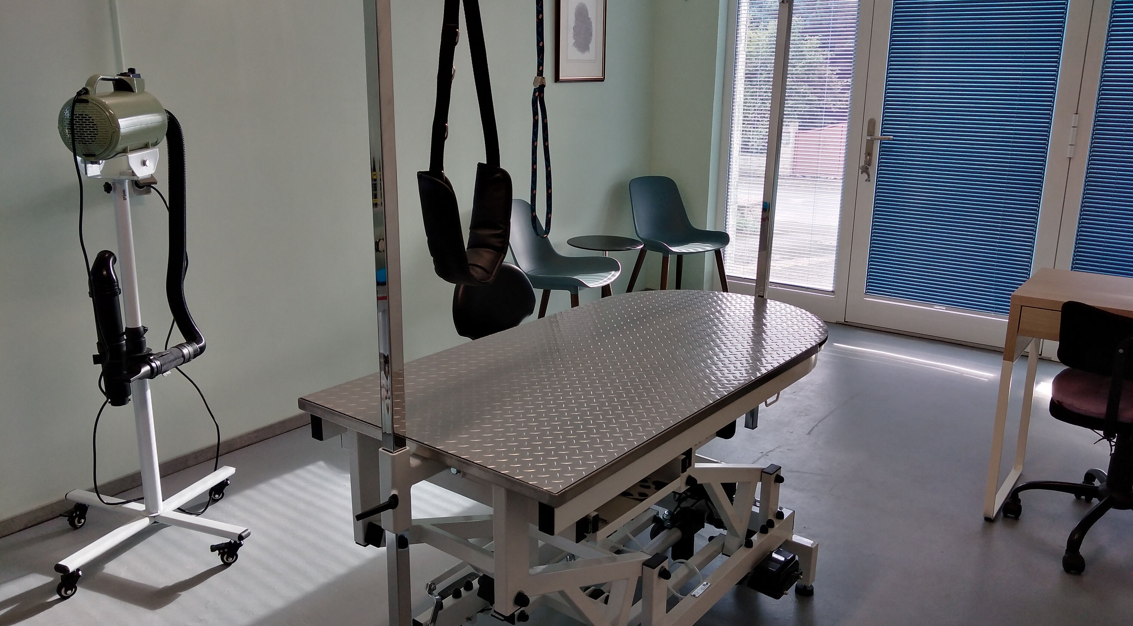 Dogstar venue in Niederanven, Luxembourg offering a serene wellness room with modern treatment table.