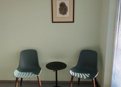 Modern seating area at Dogstar, featuring two chairs and a table in Niederanven, Luxembourg, LU.