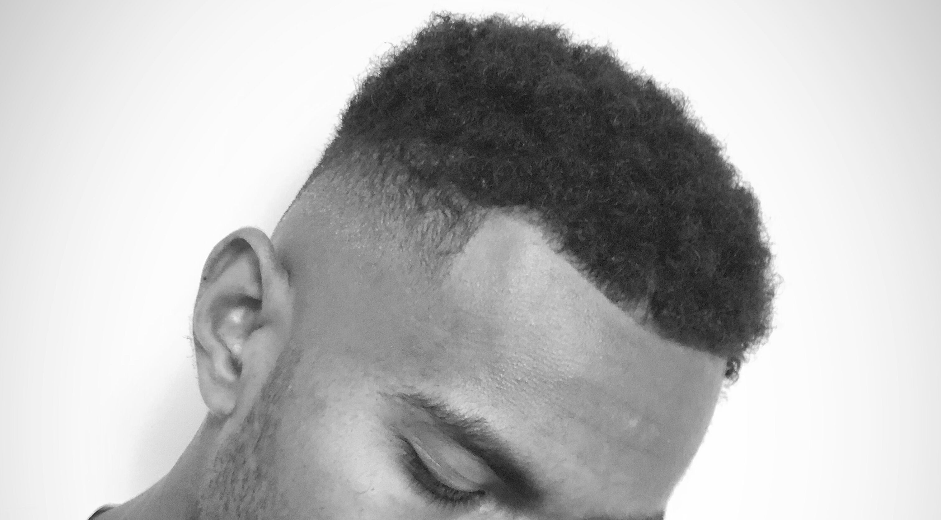 Close-up of a stylish fade haircut at Fellow Barber, Swindon, England, GB. Perfectly groomed and textured hairstyle.