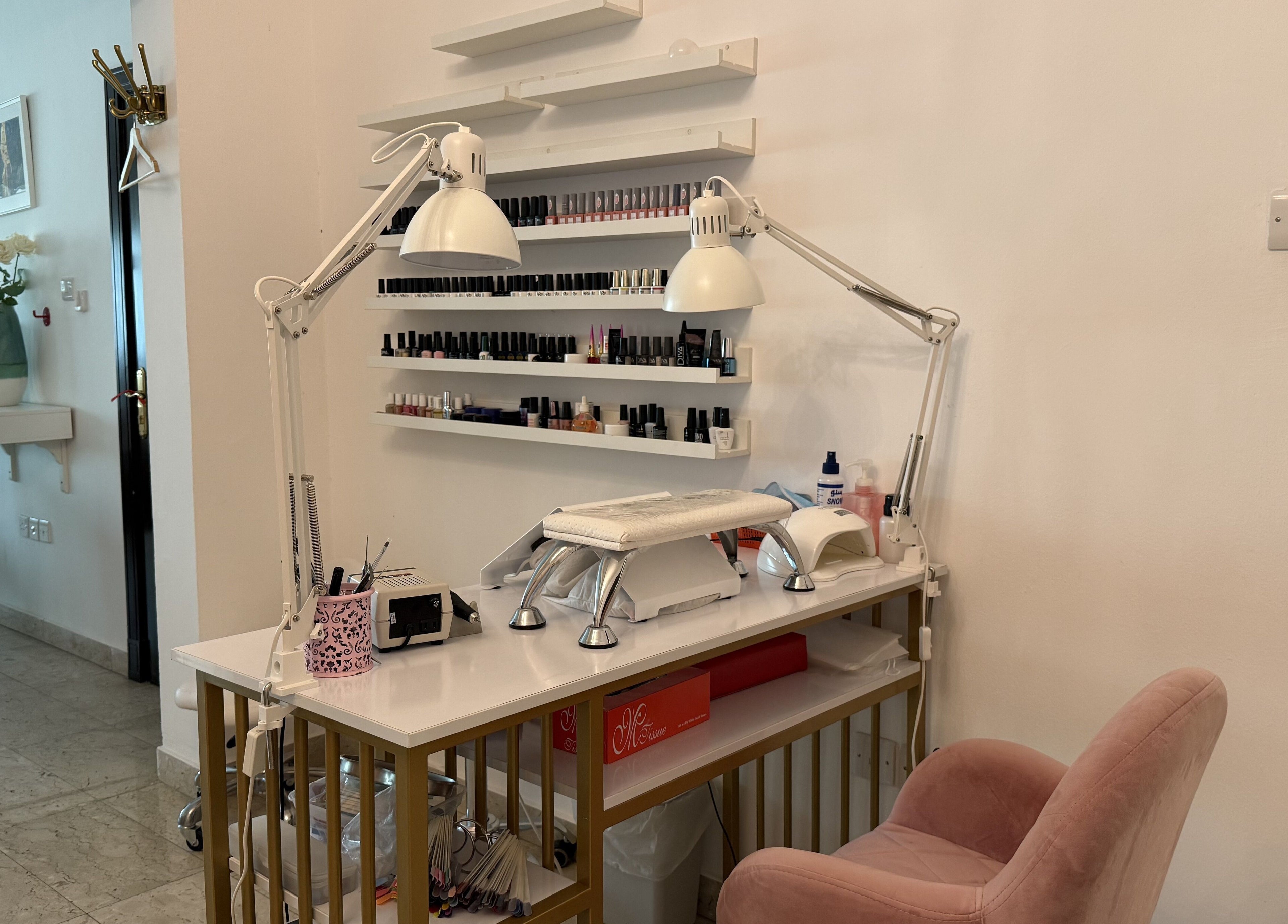 Sculptor by Aray Kairkanova nail station in Muscat, Muscat Governorate, OM with manicure tools.