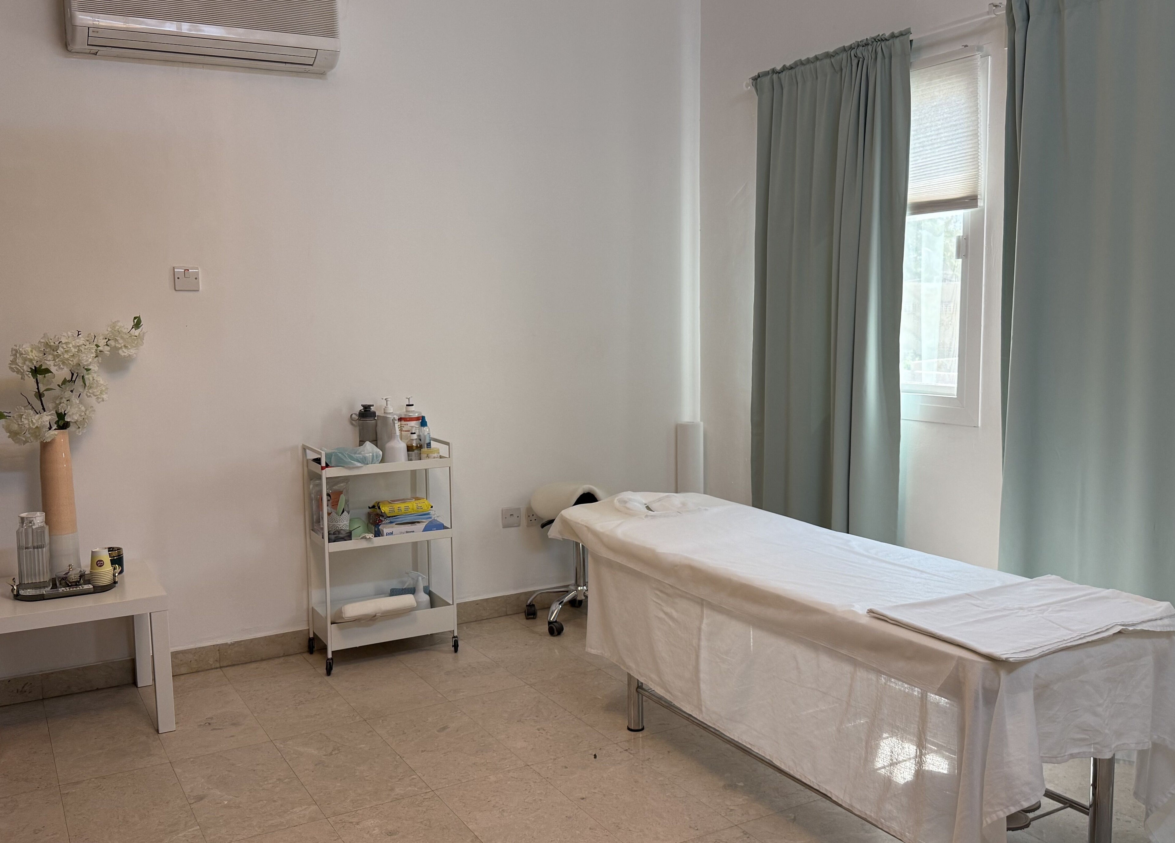 Sculptor by Aray Kairkanova in Muscat Governorate offers a serene massage room with calming decor.