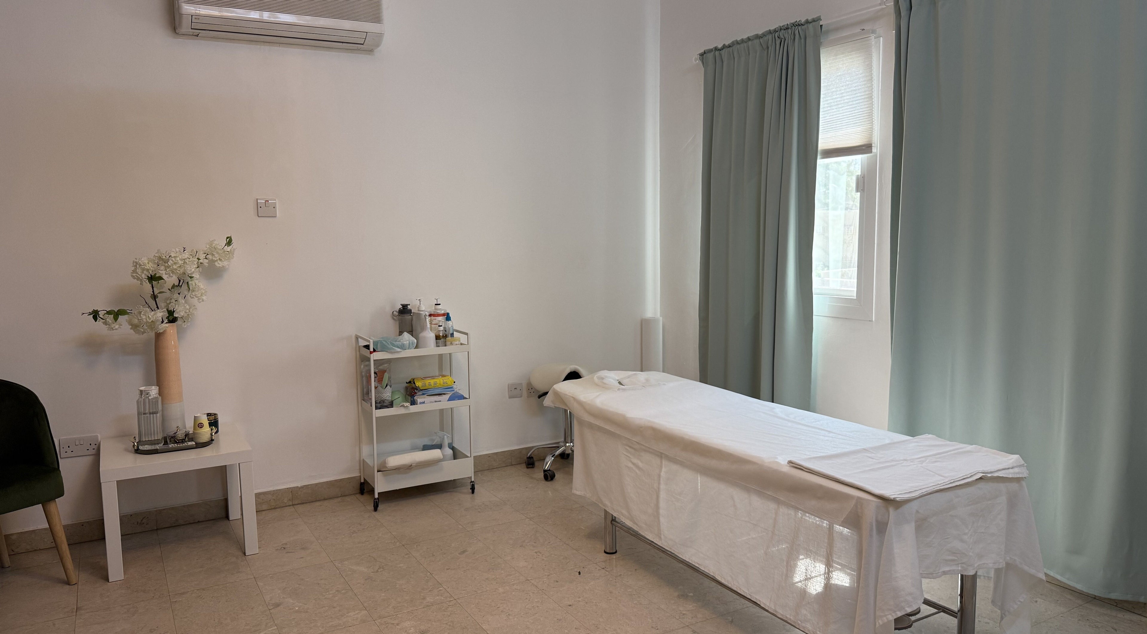 Sculptor by Aray Kairkanova in Muscat Governorate offers a serene massage room with calming decor.