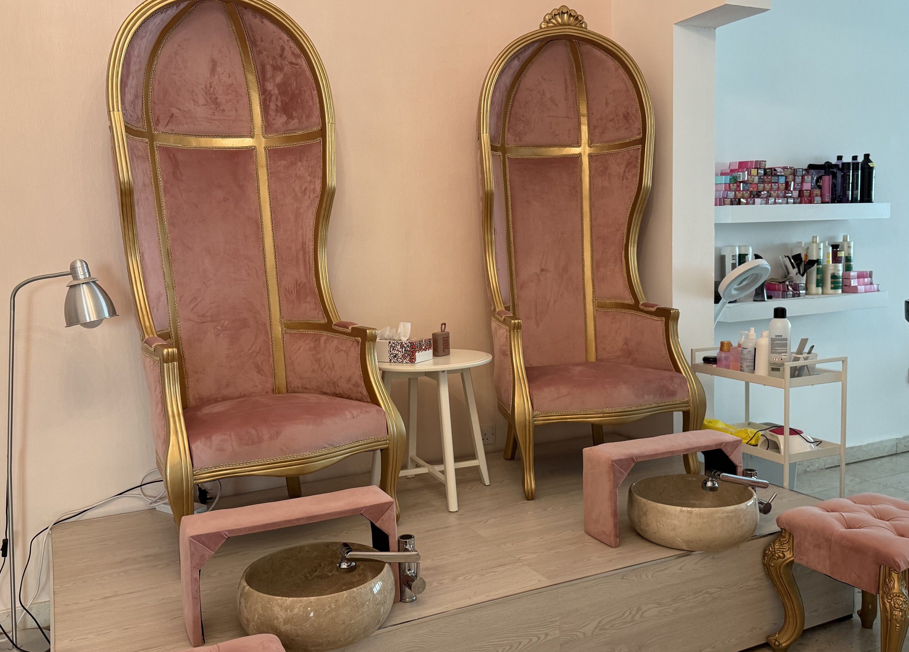 Luxurious pink and gold pedicure chairs at Sculptor by Aray Kairkanova in Muscat, Muscat Governorate, OM.