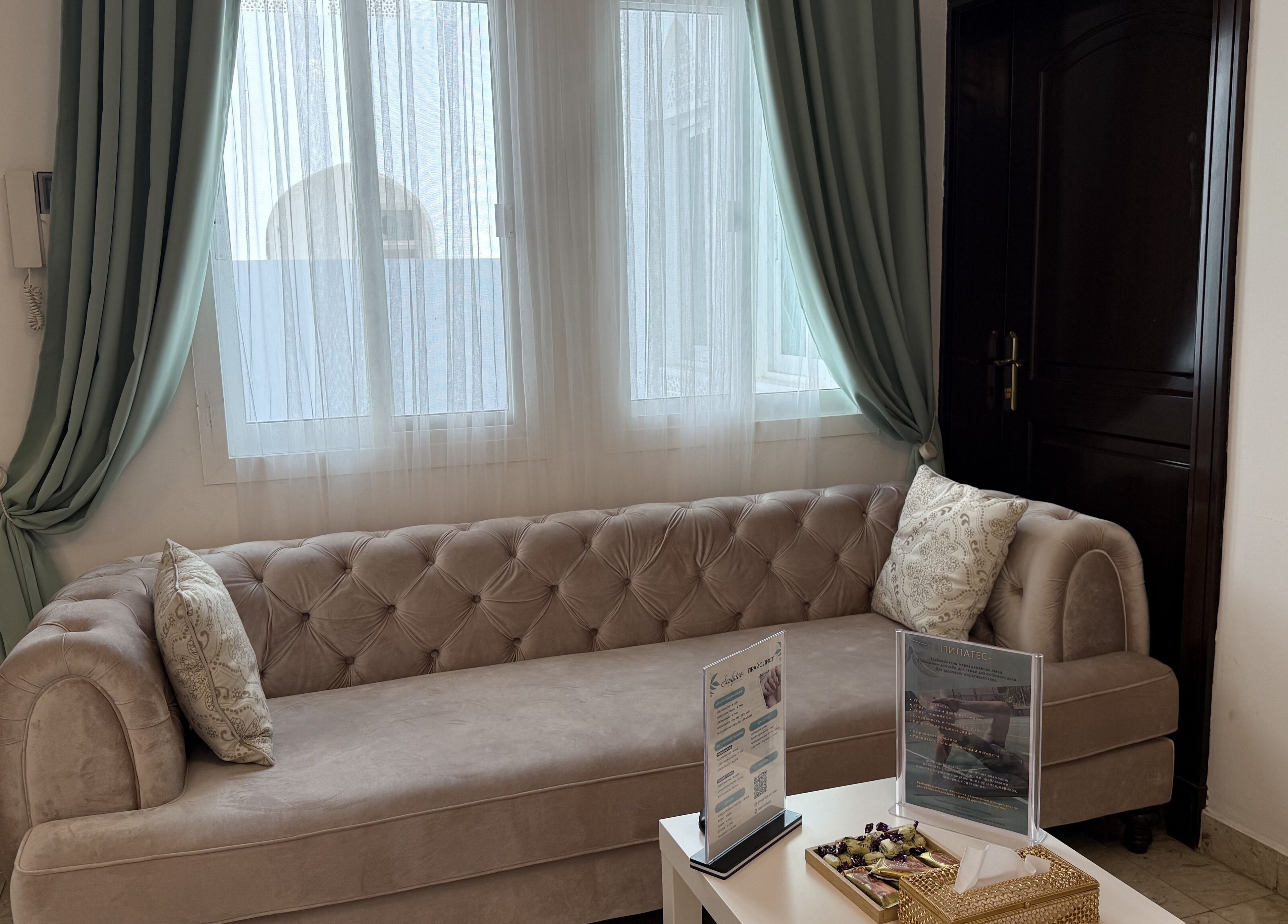 Luxurious seating area at Sculptor by Aray Kairkanova, Muscat, Muscat Governorate, OM with plush sofa and decor.
