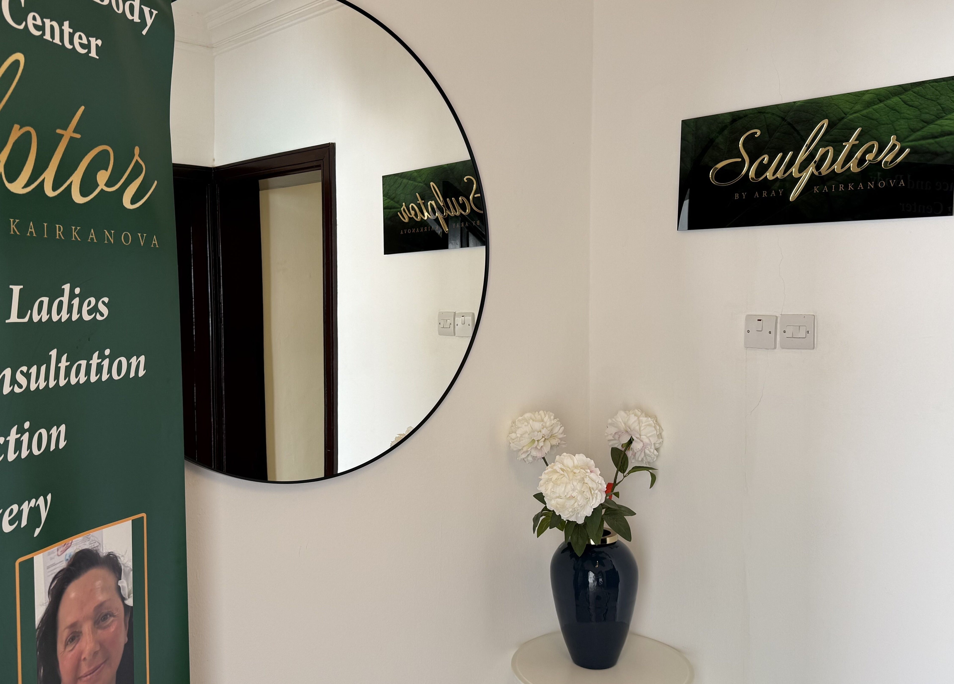 Interior of Sculptor by Aray Kairkanova, Muscat. Features a round mirror and chic decor.