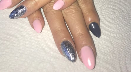 Elegant pink and glitter nails from Unique Beauty & Aesthetics in Rhosllanerchrugog, Wales, GB.
