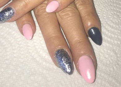 Elegant pink and glitter nail art at Unique Beauty & Aesthetics, Rhosllanerchrugog, Wales, GB.