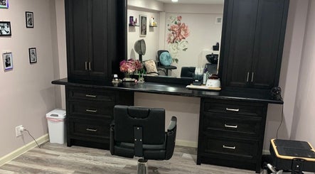 Elegant salon setup at Rachael Fratzel, featuring dark wood cabinetry in Kansas City, Kansas, US.