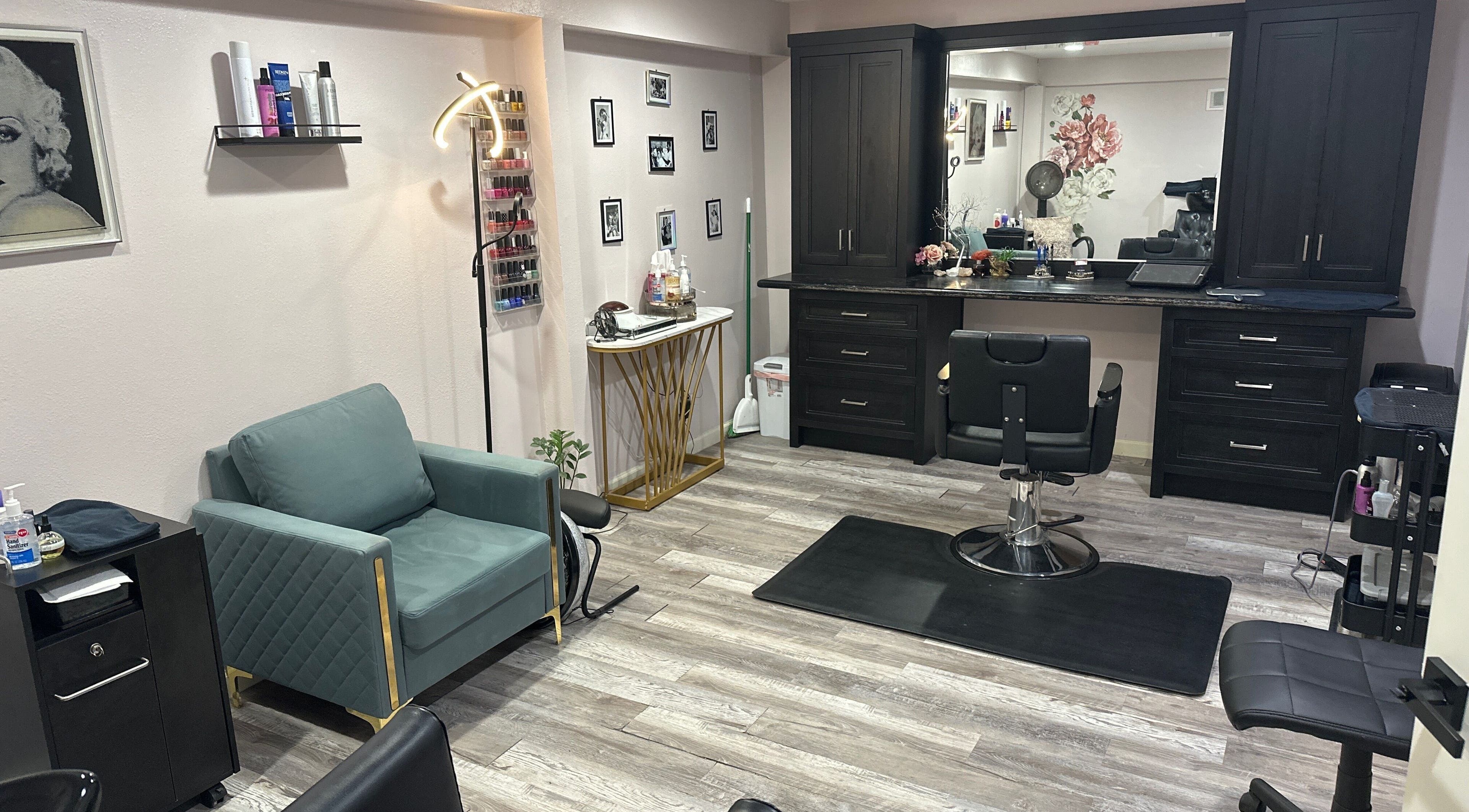 Spacious interior of Rachael Fratzel salon in Kansas City, Kansas, US, featuring stylish chairs and decor.