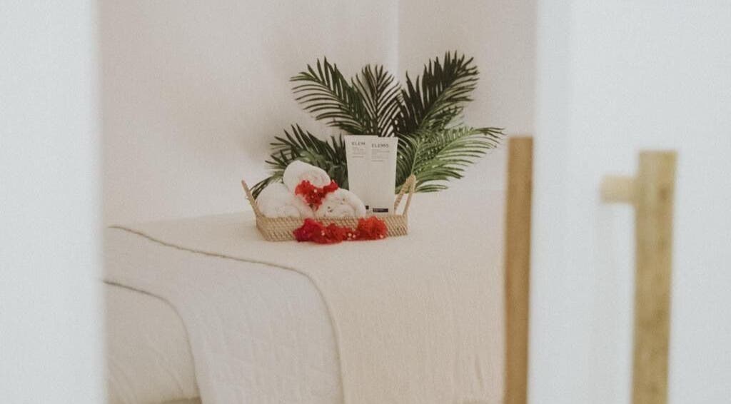 Elegant spa setup at The Cure, Tortola, Tortola, VG, featuring lush plants and premium towels.