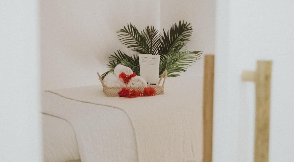 Elegant spa setup at The Cure, Tortola, Tortola, VG, featuring lush plants and premium towels.