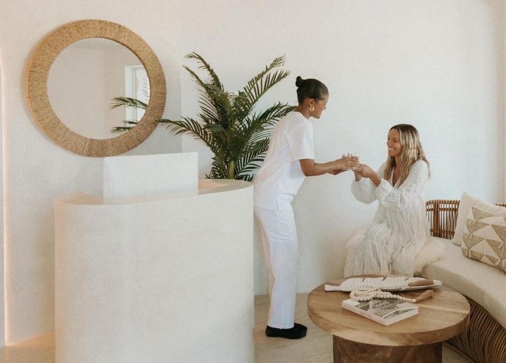 Reception at The Cure, Tortola, VG, showcasing a soothing exchange between staff and visitor.