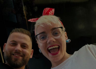Smiling individuals at LapsaBarber\M.Nometņu iela 45A in Rīga, LV, showcasing vibrant atmosphere.