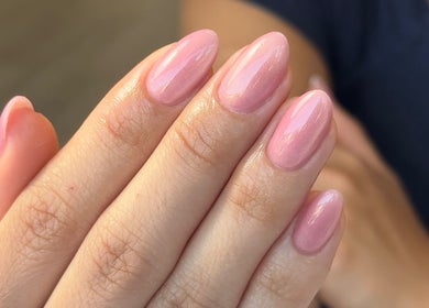 Glossy pink manicure at Ana Fernandes, Dublin, Dublin 01, IE showcasing elegant nail artistry.