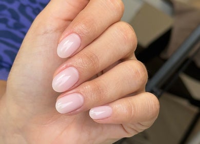 Elegant glossy manicure at Ana Fernandes, Dublin 01, IE, showcasing refined nail beauty.