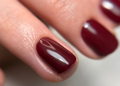 Close-up of elegant crimson nails at Ana Fernandes, Dublin, Dublin 01, IE. Perfect manicure finish.