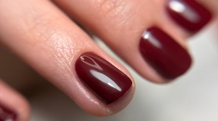 Close-up of elegant crimson nails at Ana Fernandes, Dublin, Dublin 01, IE. Perfect manicure finish.