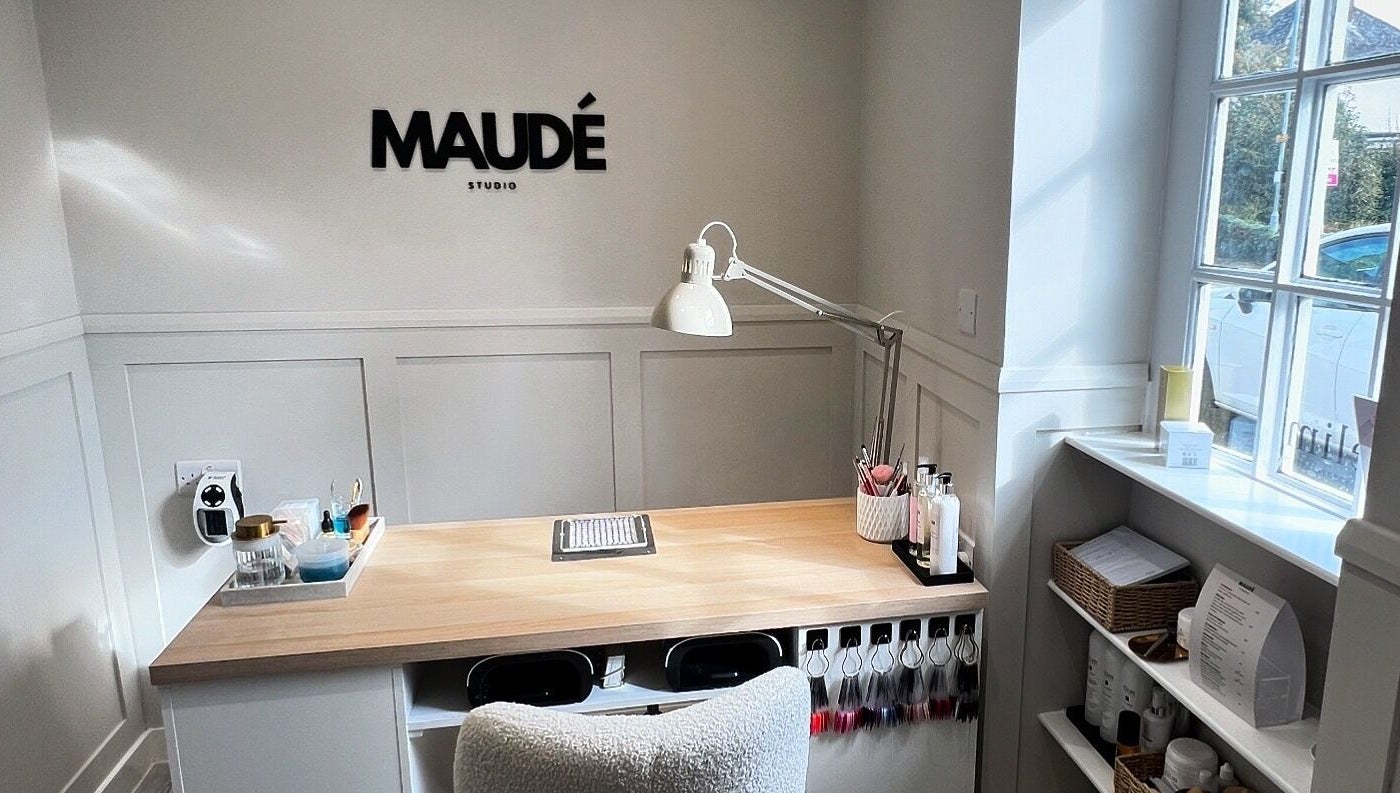 Sleek desk setup at MAUDÉ Studio, Bassingbourn, England, GB, with modern decor and organized beauty tools.