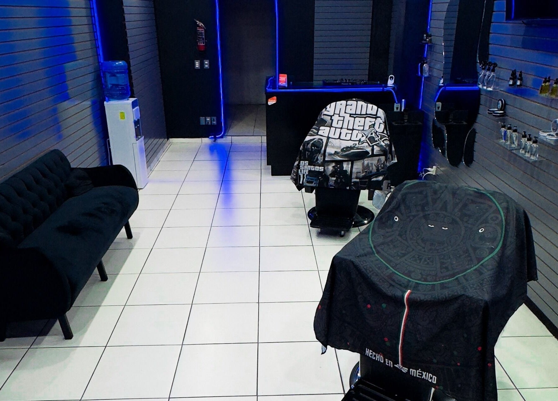 Modern barber interior at Barberia Mercurio, Zapopan, Jalisco, MX featuring sleek design and grooming stations.