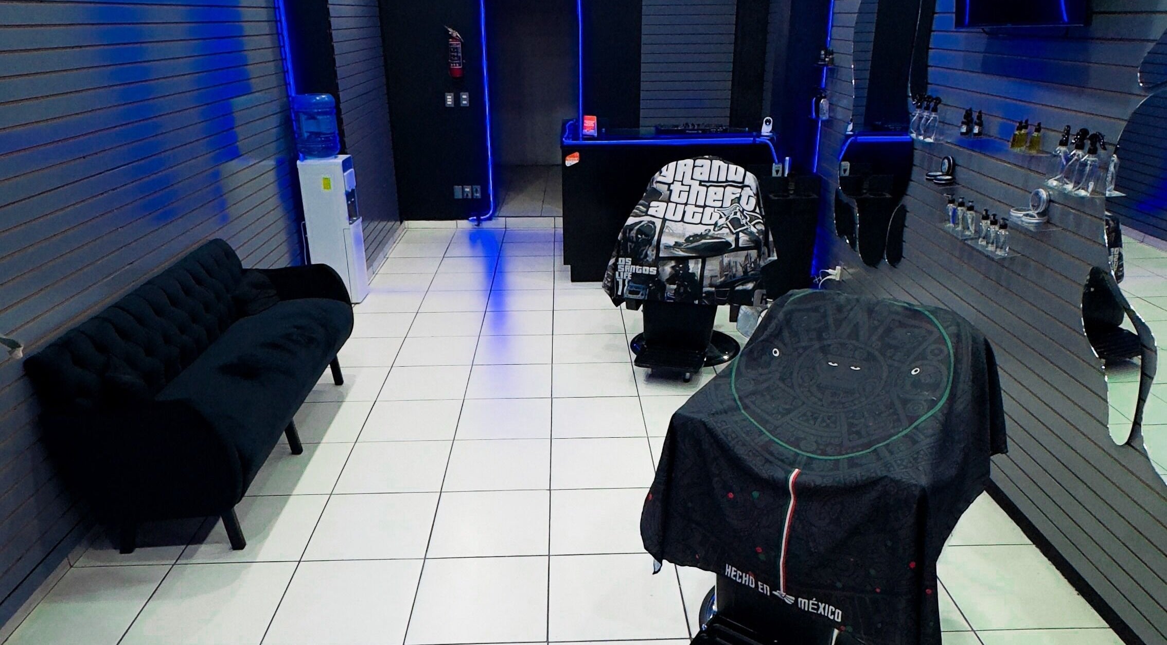 Modern barber interior at Barberia Mercurio, Zapopan, Jalisco, MX featuring sleek design and grooming stations.